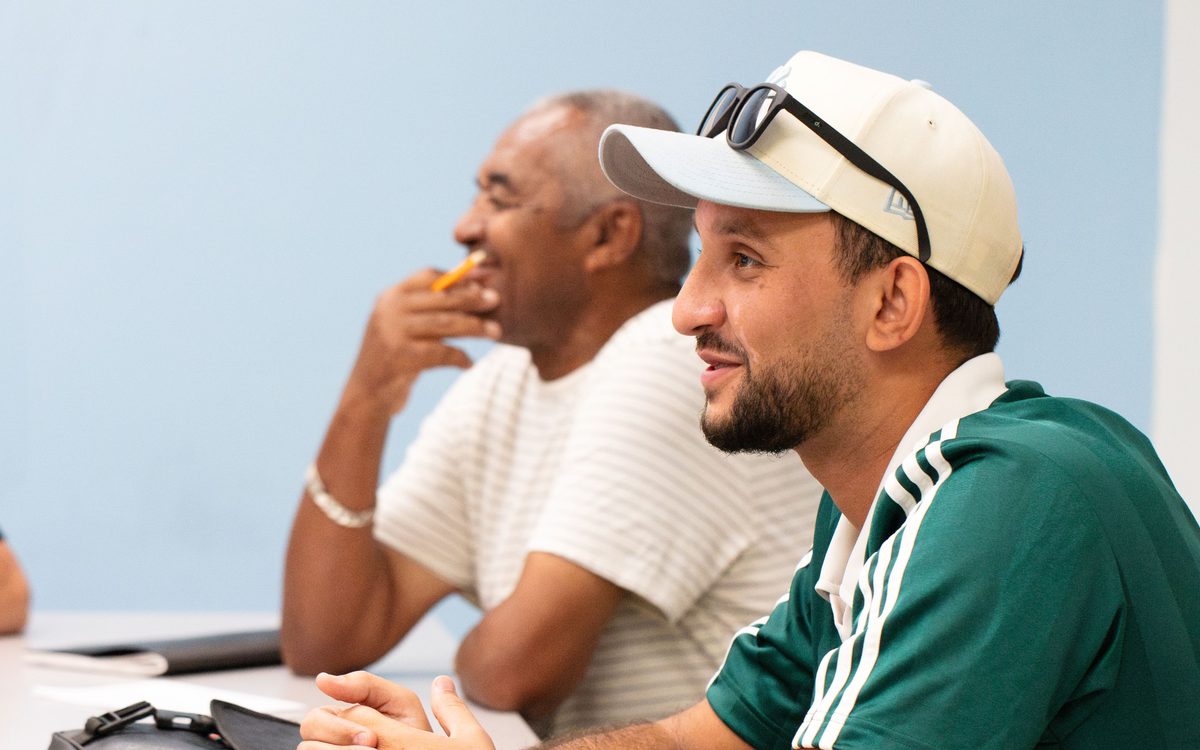 Two students listening during a class at the English Learning Center