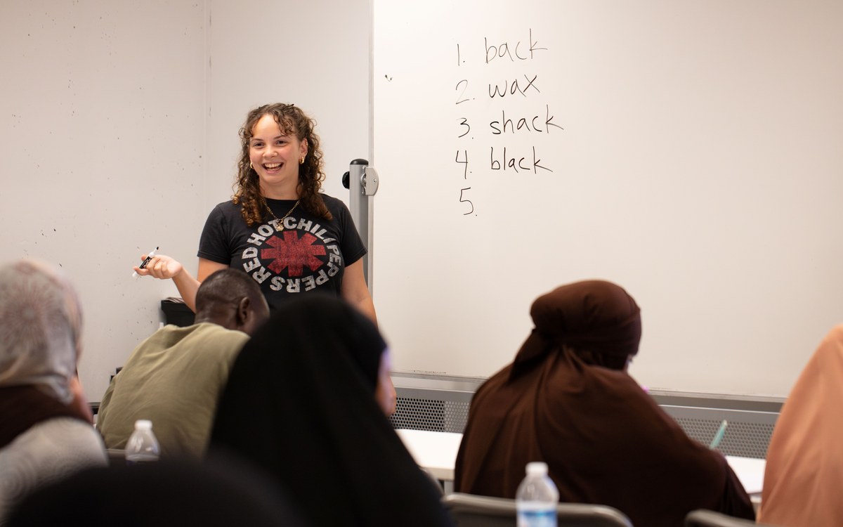 A volunteer teacher with a class at the English Learning Center