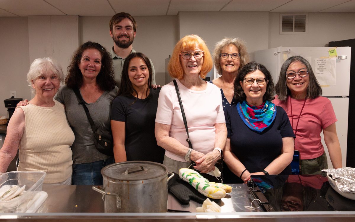 A volunteer group in the shelter kitchen before serving dinner