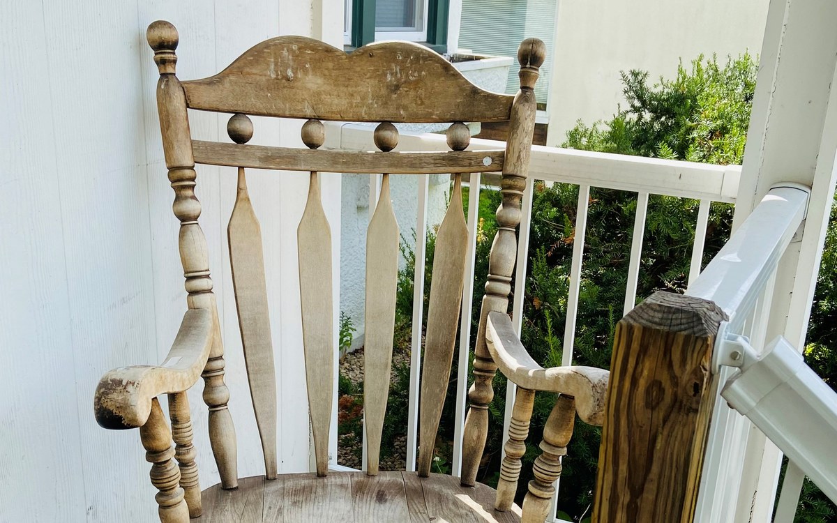 A rocking chair on the porch at one of our permanent supportive housing homes